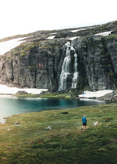 Waterfall hiker and his dog