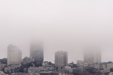 Fototapeta na wymiar Heavy morning fog surrounds San Francisco in autumn