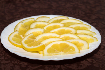 lemon slices on a white plate