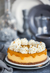 Delicious mango cheesecake decorated with whipped cream