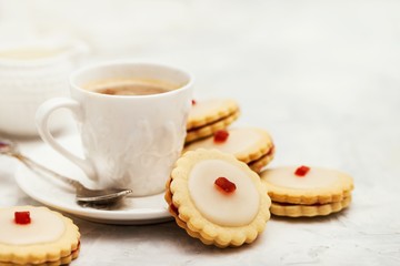 Empire shortbread sandwich cookies and cup of coffee