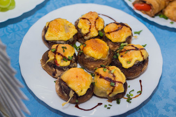 Stuffed mushrooms with meat and cheese