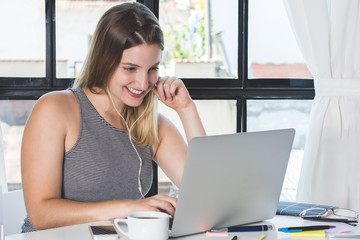 Fototapeta premium Woman working on laptop at home.