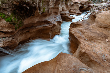 Slot canyon filled with clean blue water