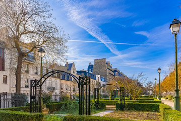 Paris, beautiful buildings and houses, typical facades boulevard Pereire, with a public park on the...