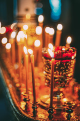 Traditional  Burning Candles In Holder In Christian Church