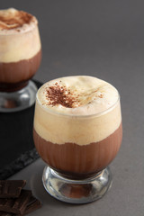 Coffee affogato with vanilla ice cream and espresso. Glass with coffee drink and icecream. Copy space.