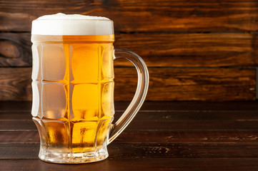 glass of cold frothy lager beer