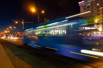 Fototapeta na wymiar The motion blurred tram in the evening