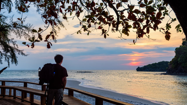 Traveler looking at the sunset on Tarutao island, Thailand