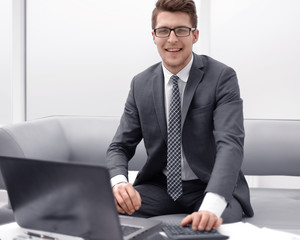 successful businessman sitting at his Desk