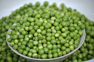 A grain of peeled young green peas