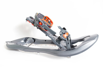 Fastener detail of snowshoes, studio shot. Winter hiking equipment.