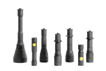 Many camping or tactical handheld pocket black flashlights isolated studio shot