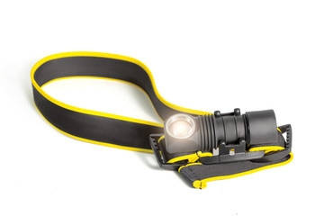 Head lamp flashlight with light beam studio shot