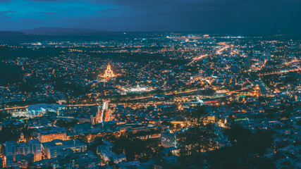 Fototapeta premium Tbilisi Georgia. Scenic Panoramic Top Field Of Vision. Cityscape In Evening Illumination, Landmarks