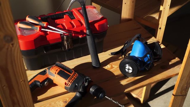 Work tools - electric drill, hammer, protective mask, box with instruments and screwdrivers