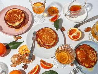 Pancakes with fruit, honey, nuts. The concept of a delicious breakfast. Top view.