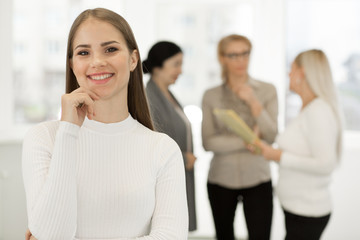 Happy businesswoman working at the office