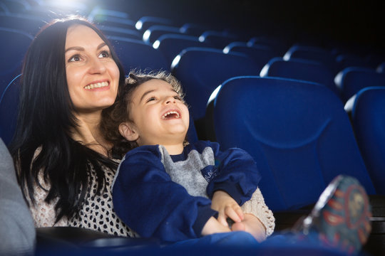 Happy Family Watching Movies At The Cinema