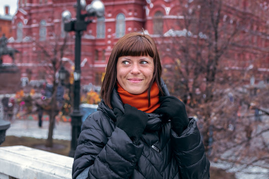Young russian woman on a Red Square close to Kremlin. Moscow city.