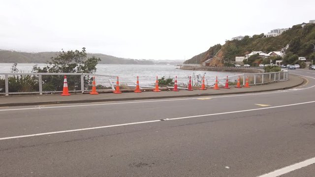 Pan across road side crash in Evans bay, Wellington New Zealand