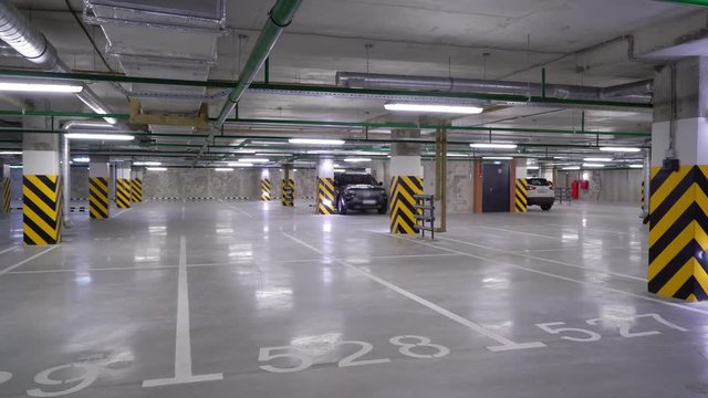 Empty underground parking garage. Cars