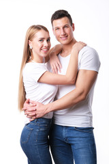 Romantic couple embracing each other on white