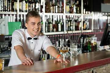 Attentive service. Bartender ready for new orders.
