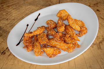 Crispy Breaded tenderloin of chicken with sesame.
