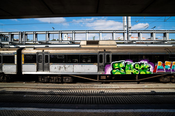 Old train cart with grafitti at a train station