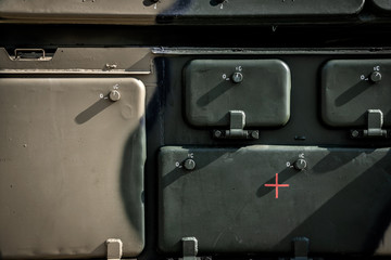 Green metal surface of the military vehicle