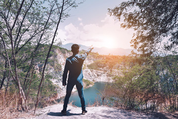 Man standing on rock mountain at sky view background copy spec,travel