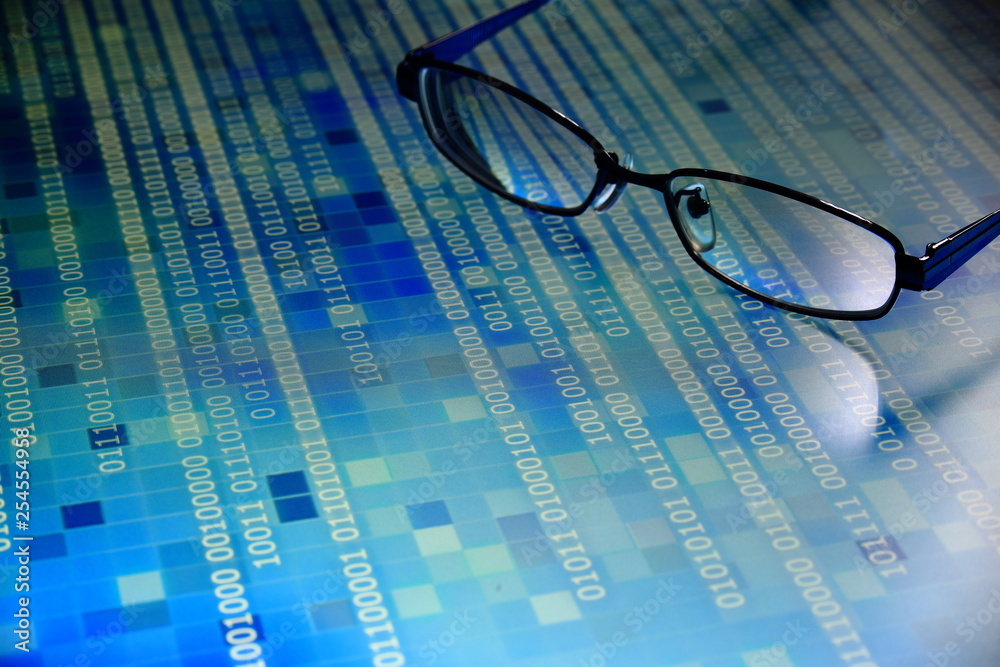 Aufkleber big data analysis. blue binary code on led panel with black background and glasses placed over the information panel. hacker and source code analysis.