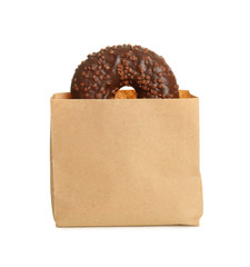 Paper bag with donut on white background. Space for design