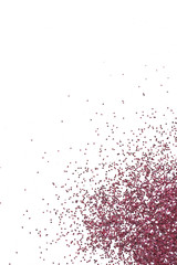 Pink glitter on white background, top view