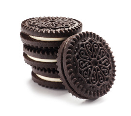 Tasty chocolate cookies with cream on white background