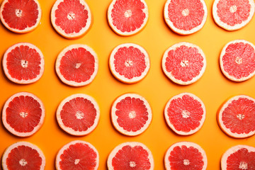Fresh sliced ripe grapefruit on color background, flat lay
