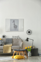 Stylish living room interior with comfortable sofa. Idea for home decor