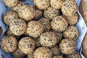 Coconut rice balls with sesame seeds is traditional Thai dessert made from rice flour and coconut milk at street food market in Thailand