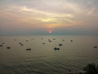 Naklejka premium Boat on the sea at sunset