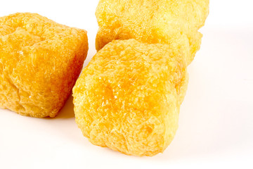 Dry tofu isolated on white.