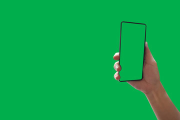Top View holding hand smartphone with green screen Isolated on background with clipping path.