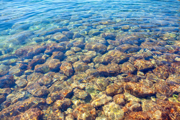 stones under transparent sea water
