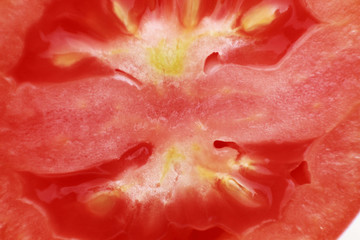 Cut piece of a red tomato macro
