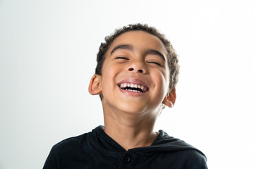 portrait of a laughing boy isolated on white