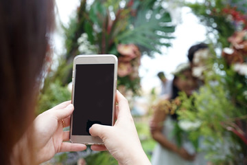 Human hand using smartphone with black screen