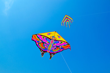 colored kite flying in the blue sky