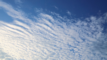 sunlight shiny through white cloud on blue sky background