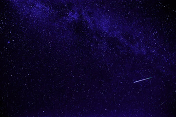 purple night starry sky with shooting star